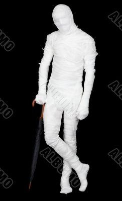 Man in costume mummy and umbrella