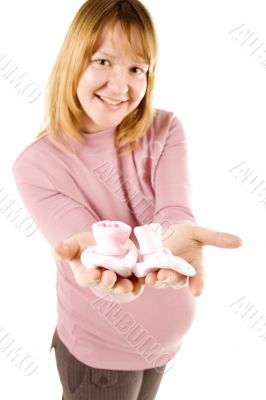 pregnant woman holding pair of socks