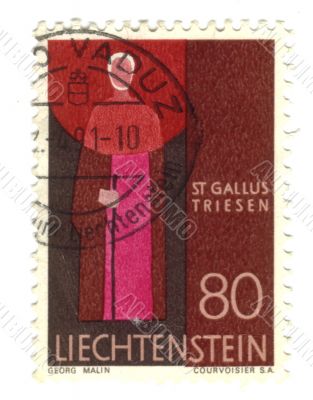 Old stamp from Liechtenstein with priest