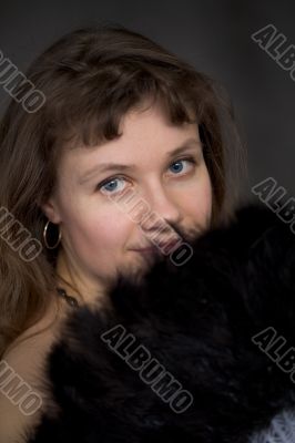 Portrait of thel girl with a fan