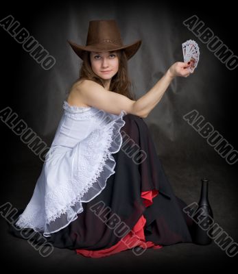 Girl with a playing-cards in hand