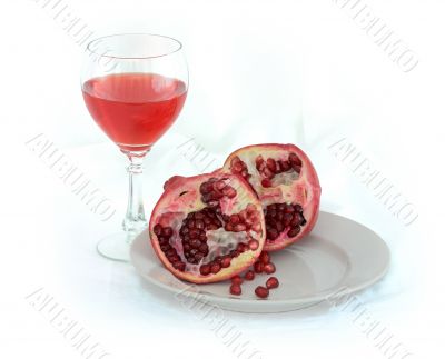 Still-life with a glass of wine and pomegranate