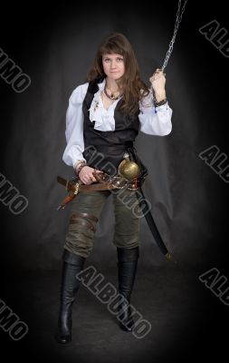 The girl - pirate with a sabre in hands