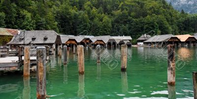 Boat houses and mooring posts on lake
