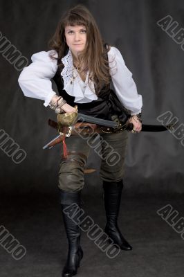 The girl - pirate with a sabre in hands
