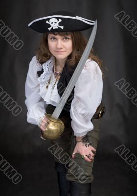 The girl - pirate with a sabre in hands