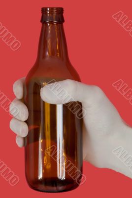 Brown bottle on hand