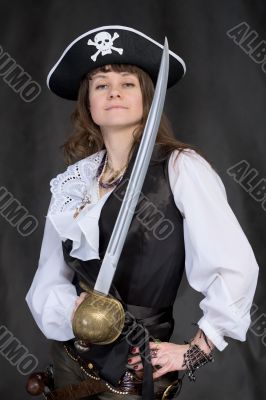 The girl - pirate with a sabre in hands