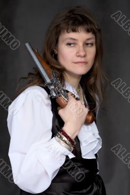 Girl - pirate with ancient pistol in hand