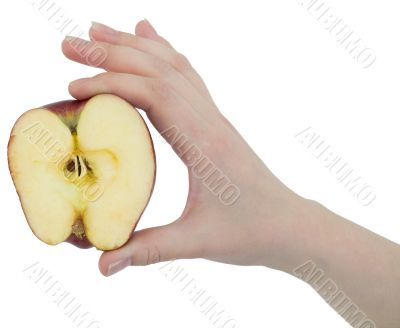 Cut apple in a female hand
