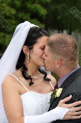 Bride and groom are kissing