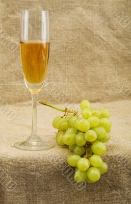 Wineglass with wine and grapes