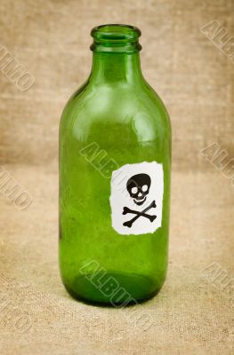 Bottle with sticker - skull and crossbones