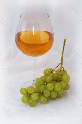 Still-life with a glass of wine and grapes