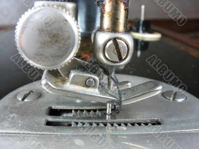 Old industrial sewing machine detail macro close up