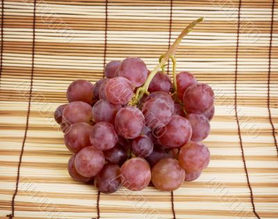Still life with red ripe grapes