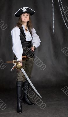 The girl - pirate with a sabre in hands