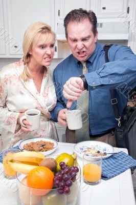 Stressed Couple in Kitchen Late for Work