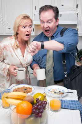 Stressed Couple in Kitchen Late for Work