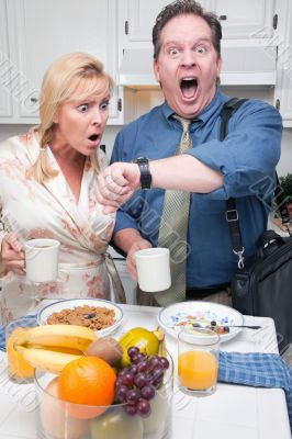 Stressed Couple in Kitchen Late for Work