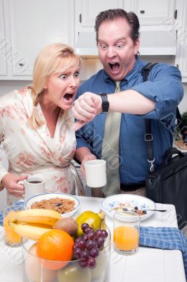 Stressed Couple in Kitchen Late for Work