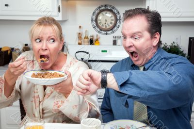 Stressed Couple in Kitchen Late for Work