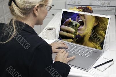 Woman In Kitchen Using Laptop - Entertainment