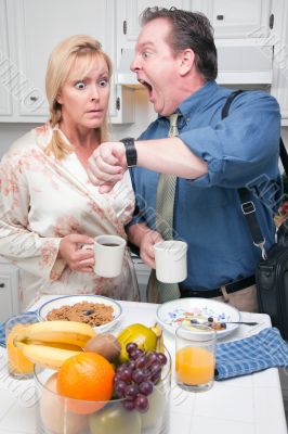 Stressed Couple in Kitchen Late for Work