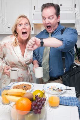 Stressed Couple in Kitchen Late for Work