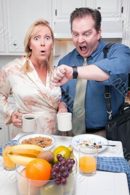 Stressed Couple in Kitchen Late for Work