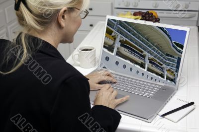 Woman In Kitchen Using Laptop- Cruise vacation