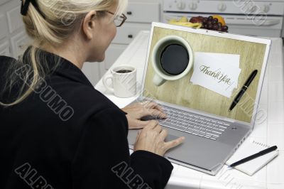 Woman In Kitchen Using Laptop - E-commerce