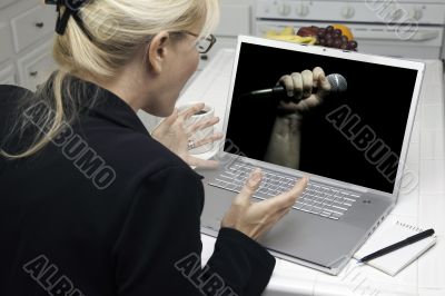 Excited Woman In Kitchen Using Laptop - Freedom of Speech