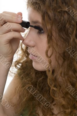 red haired female teenager with mascara