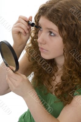 red haired female teenager with mascara