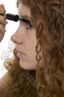 red haired female teenager with mascara