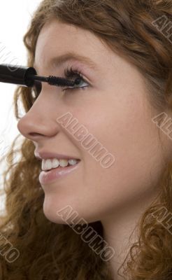 red haired female teenager with mascara