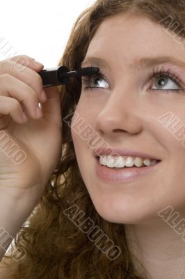 red haired female teenager with mascara