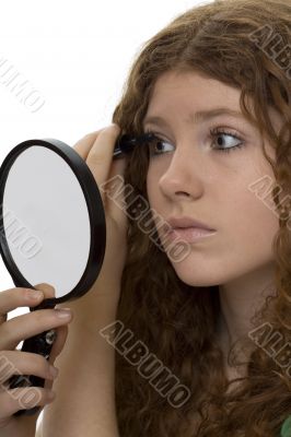 red haired female teenager with mascara