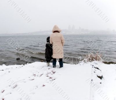 mother and daughter look at the river mother and daughter look at the river