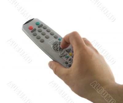 Hand holding a TV remote control isolated over white