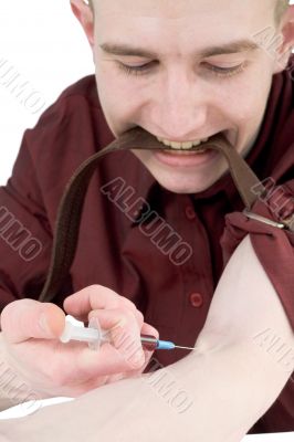 Young man to give an injection himself