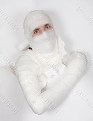 Boy in bandage put out from hole in paper Boy in bandage put out from hole in paper
