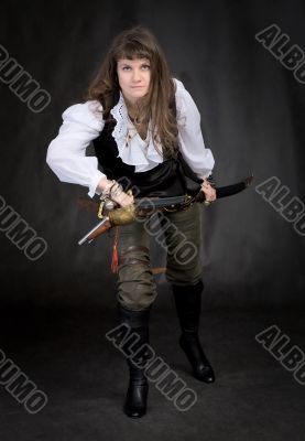 The girl - pirate with a sabre in hands