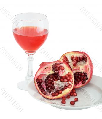 Still-life with a glass of wine and pomegranate