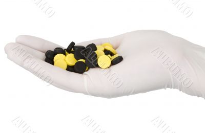 Tablets on hand in glove