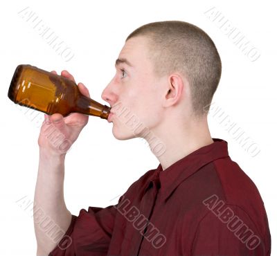 Young man with brown bottle