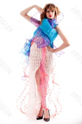Teenage girl in a stylised dress striking a pose