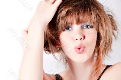 Portrait of a young cute girl whisteling at you Portrait of a young cute girl whisteling at you