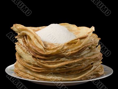 Pancakes and sugar on a plate